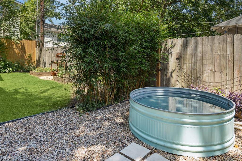 Pool is separated from rest of backyard by bamboo "fence"