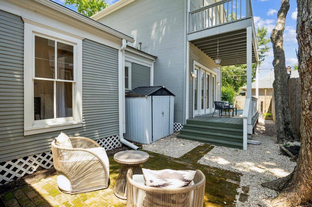 Another view of outside seating area. Another storage shed