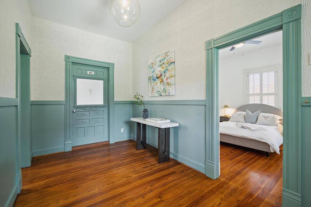 Another view of entry showing entrance to full secondary bathroom and one of the secondary bedrooms