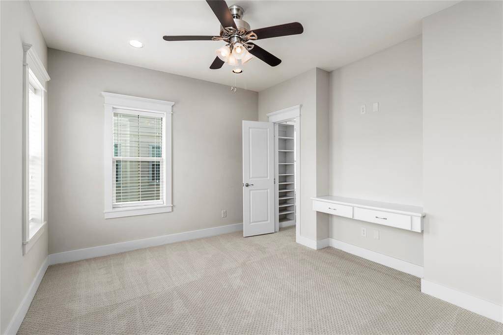 3rd Floor Bedroom-Bright room filled with natural light. Built-In Desk and drawers. Spacious closet with built-in shelves.