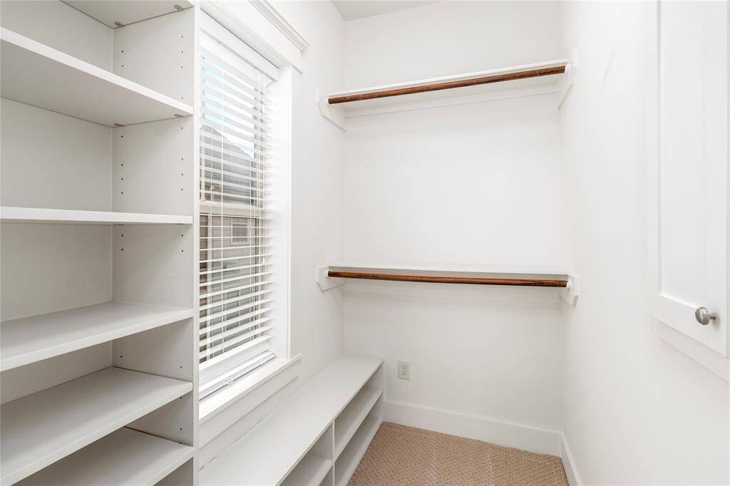 3rd Floor Bedroom Closet-Window allows in for natural light. Convenient built-in shelves for more space.