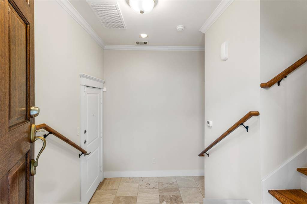 View from Front Entry. Steps down to 1st floor Bedroom.