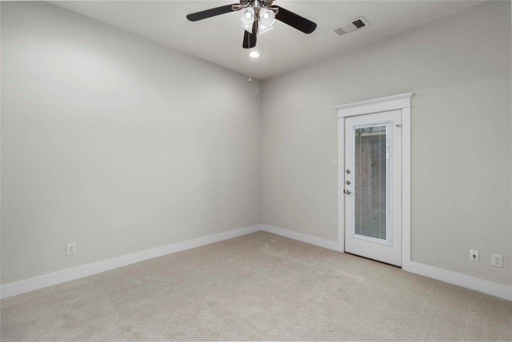 1st floor Bedroom. All new carpet. Glass paneled door which leads to the Side Yard.
