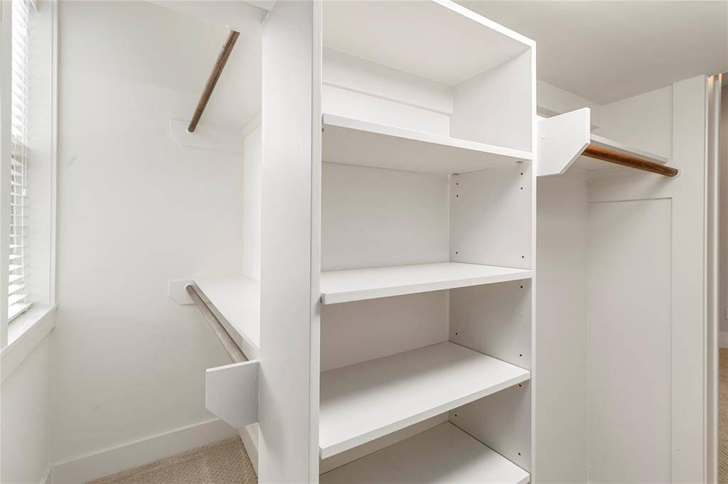 Large closet with ample space & window for natural light.