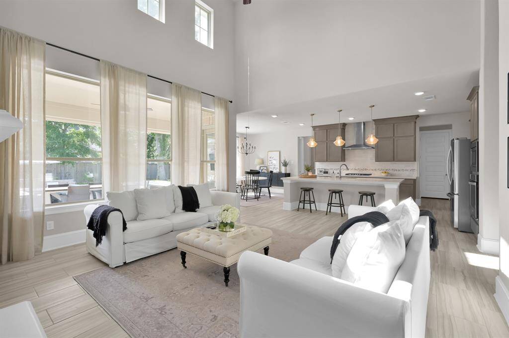 Open concept kitchen, dining, and living space.
