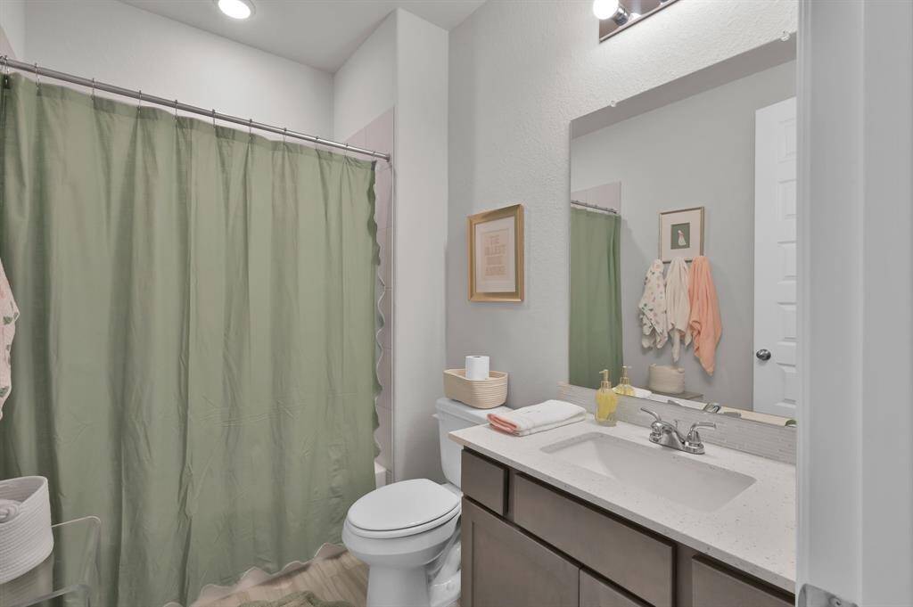 Full bathroom located just outside the door of secondary bedroom #1 all offered on the 1st floor.