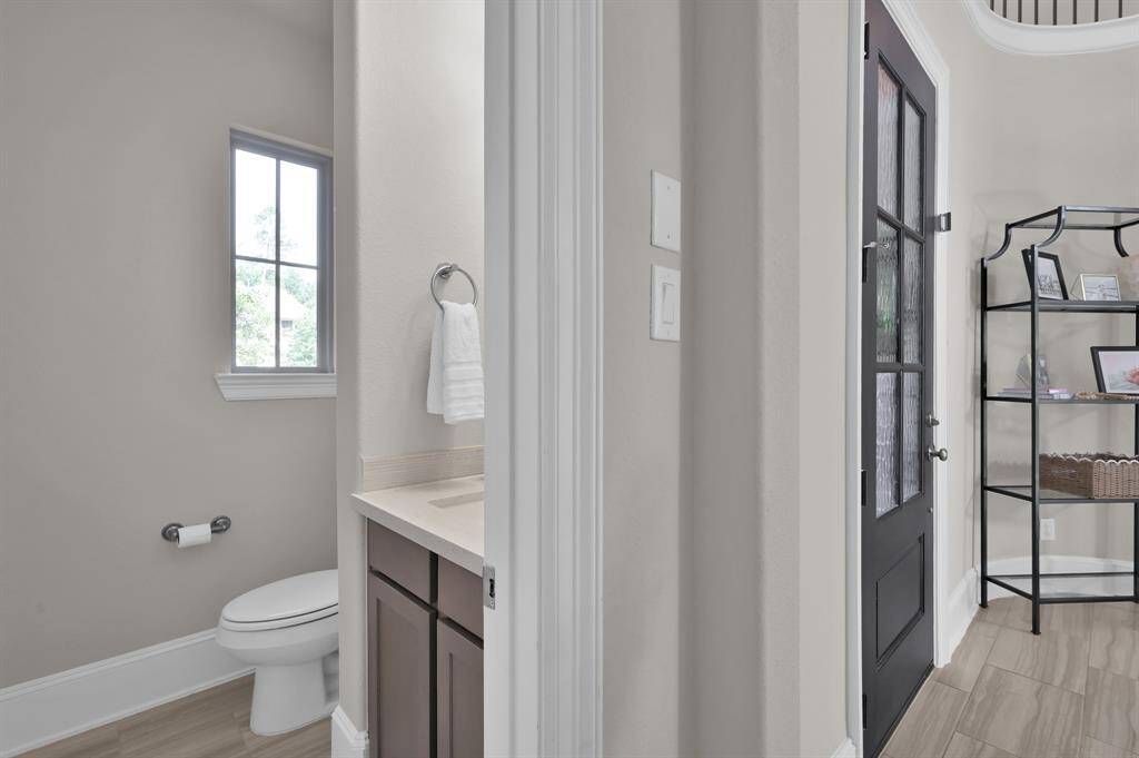 Half bath conveniently located on the 1st floor towards the front home near ONE of the TWO garage entry points.