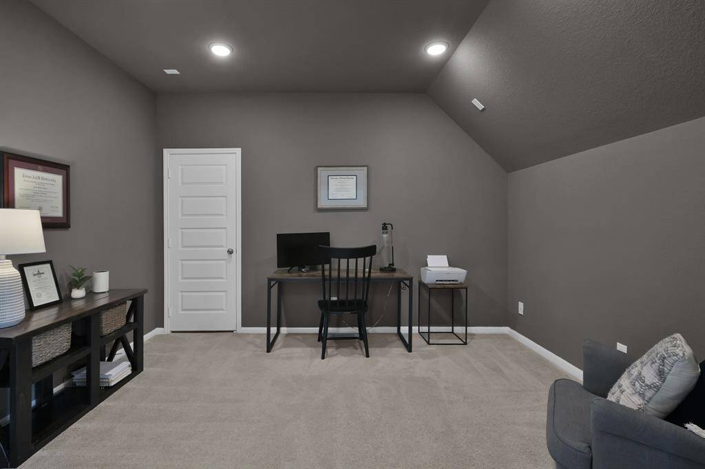 Media room, wired for sound, currently being utilized as a secondary office.