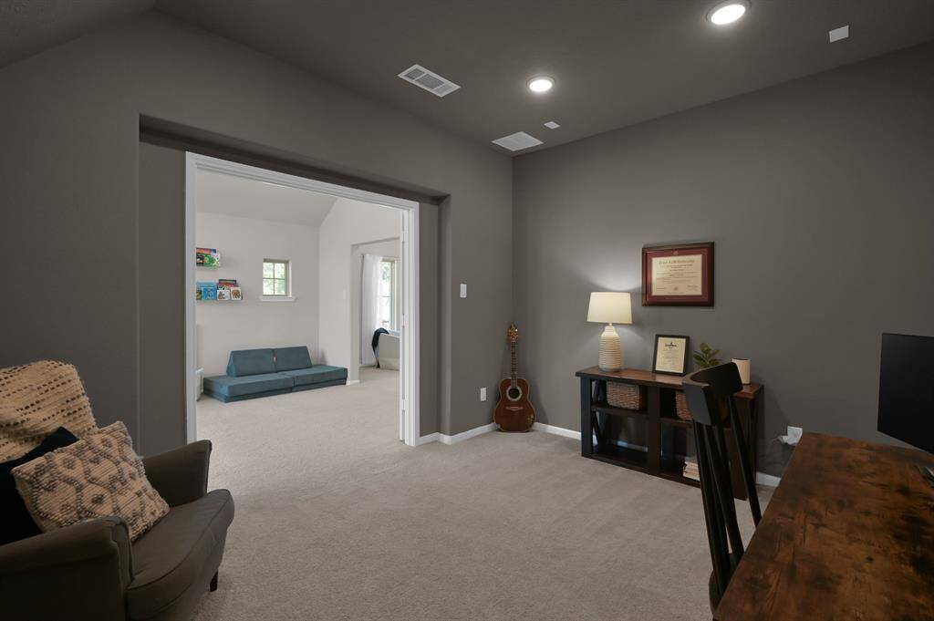 Media room, wired for sound, currently being utilized as a secondary office.