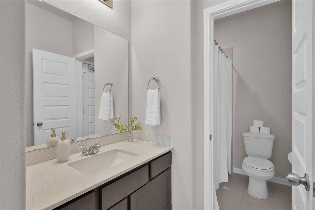 Secondary bedroom #2, located upstairs, features a Jack & Jill style bathroom with secondary bedroom #3.
