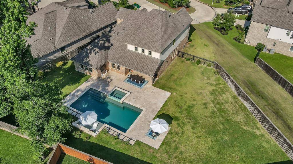 Featuring a luxurious pool and spa with travertine decking, this home offers outdoor living that outshines new construction.