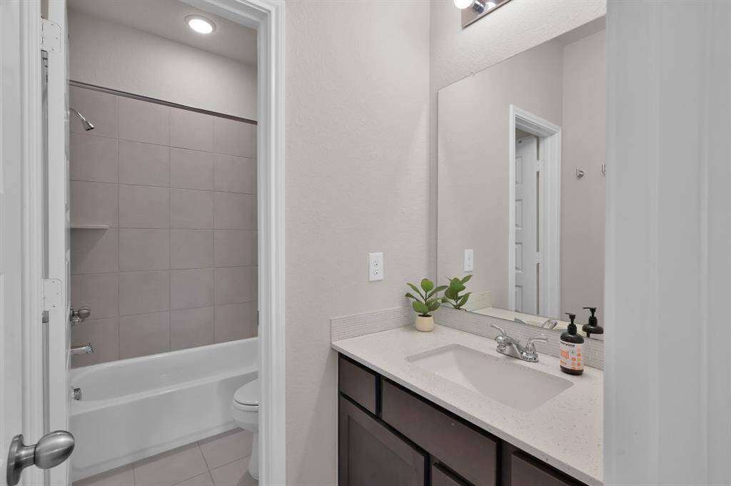 Secondary bedroom #3, located upstairs, features a Jack & Jill style bathroom with secondary bedroom #2.