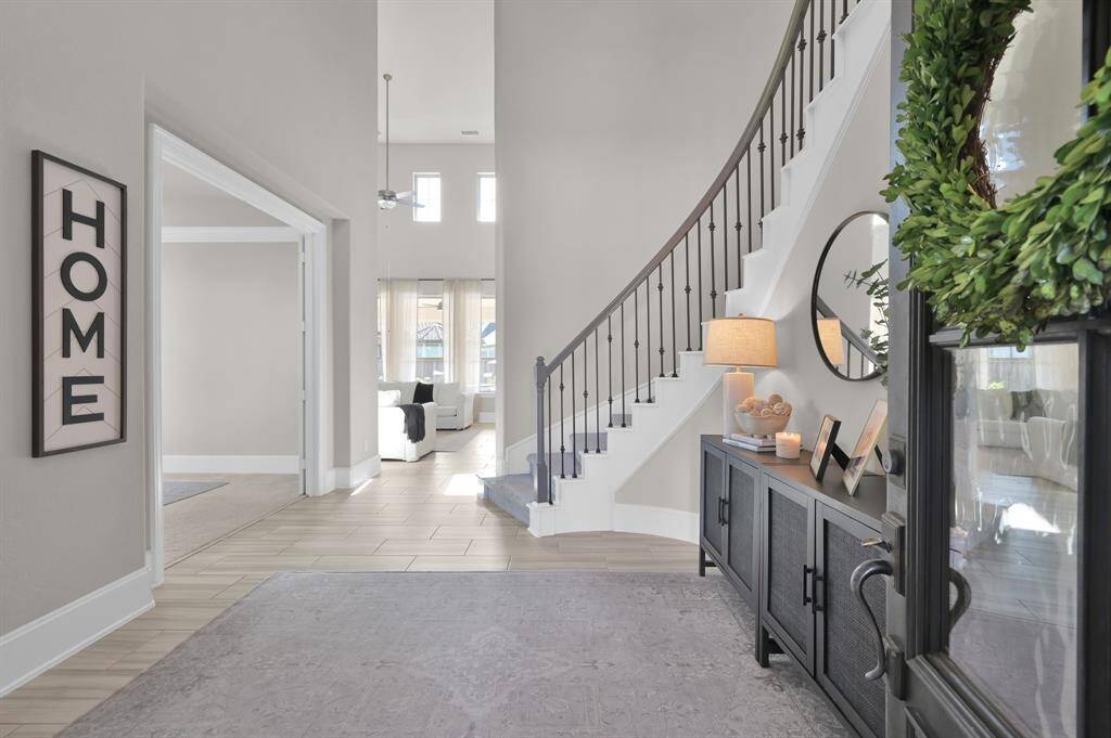 Inside, enjoy 4 spacious bedrooms (including both the primary and a guest suite downstairs), 3.5 bathrooms, a dedicated office, media room, game room, and a 3-car tandem garage.