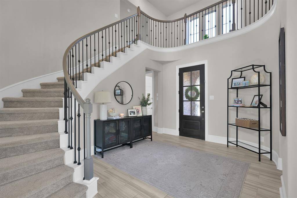 Inside, enjoy 4 spacious bedrooms (including both the primary and a guest suite downstairs), 3.5 bathrooms, a dedicated office, media room, game room, and a 3-car tandem garage.