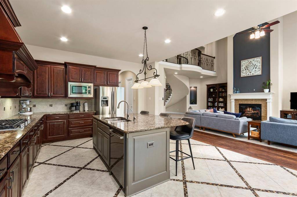 The large center island provides a wonderful spot for extra seating and additional storage.