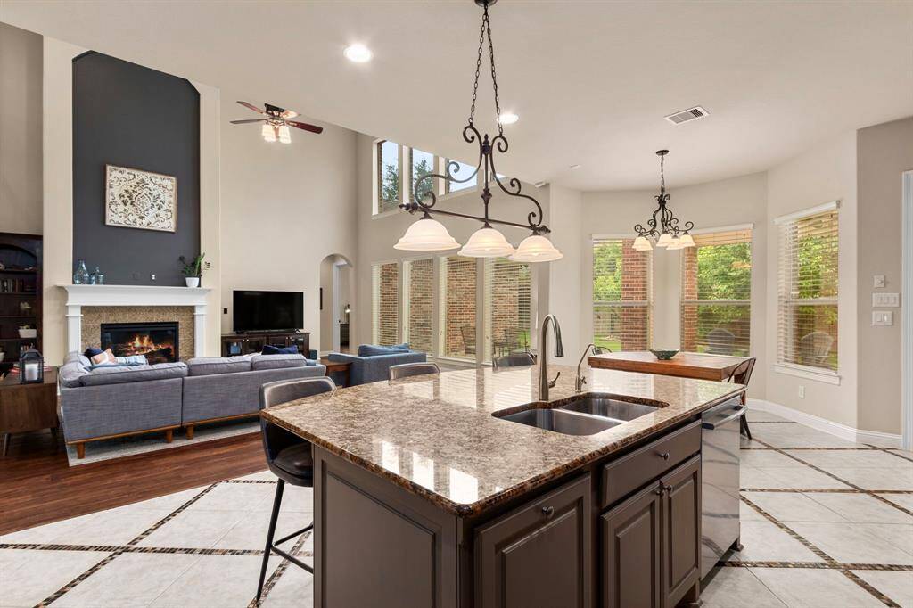 The family room and kitchen's floor plan is open creating a space that is perfect for easy living and wonderful entertaining possibilities.