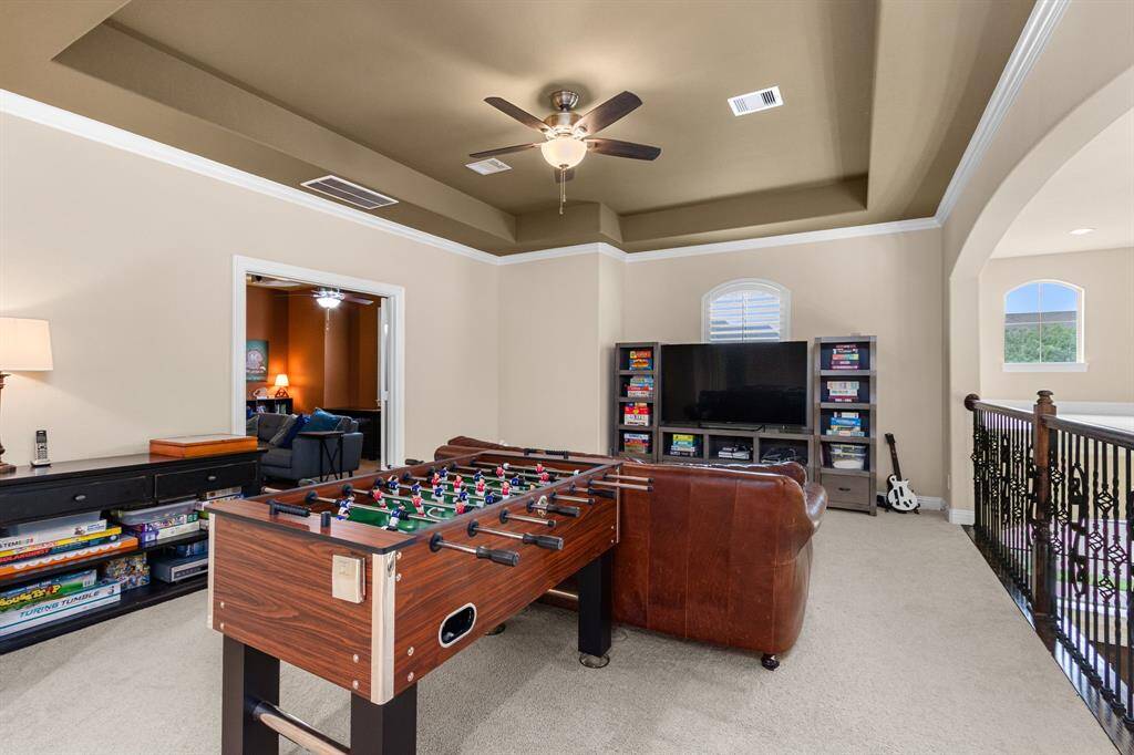 The second floor is perfect with a large gameroom, media room and three secondary bedrooms. This gameroom is spacious with plenty of room for seating, game tables and room leftover for an entertainment center and storage cabinets for games.