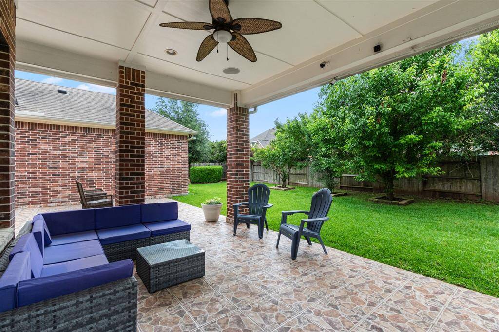 This patio provides plenty of space for seating and would be perfect for a large dining table. A wonderful place for outdoor barbeques, celebrations and dining alfresco. Three fruit trees offer privacy and treats to be enjoyed!