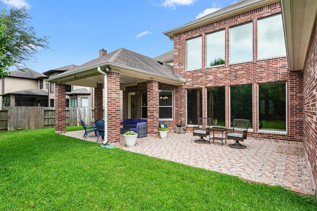 Want a place for chaise lounges for sunning and a spot for container gargening? This open patio area would be perfect.