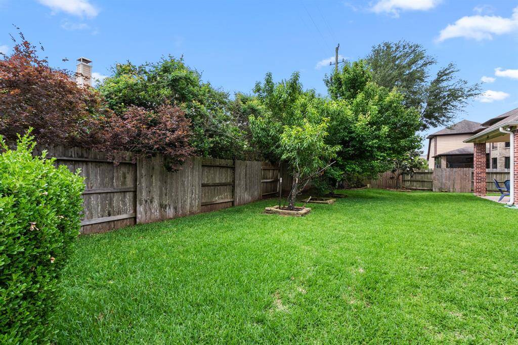 The backyard is large with lots of greenspace. A great spot for a child's playscape, gardening and for your pets to roam freely.