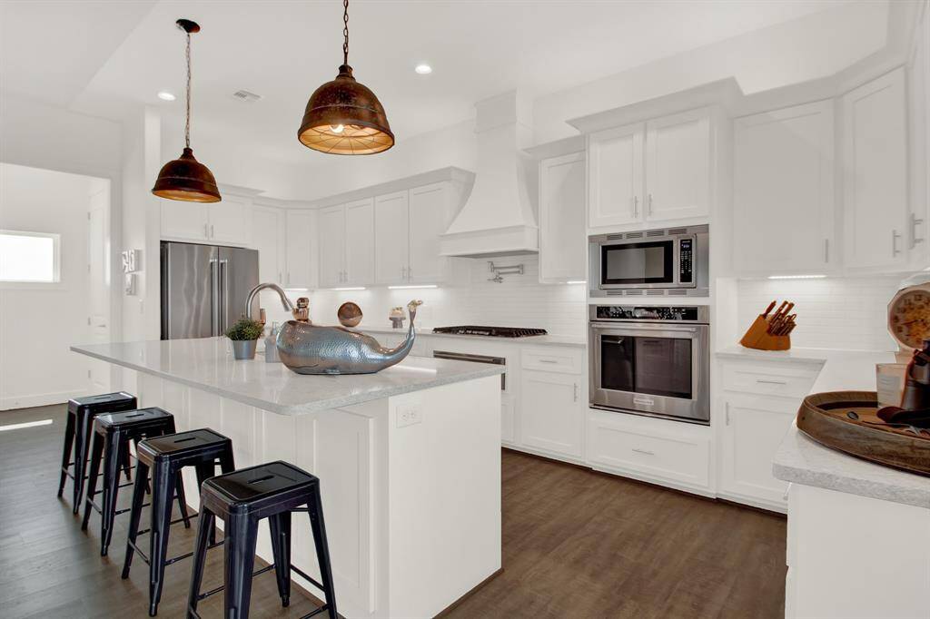 The island has room for seating at the counter height bar area or food prep when necessary.
