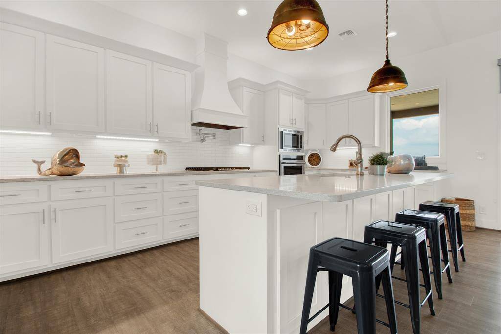 The room has a bright and airy feel with natural light streaming in from all directions.