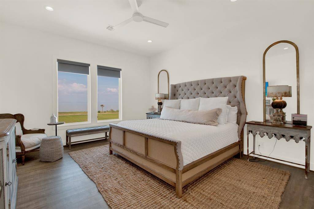 The primary room on the second level looks out at the bay and is so comfortable that you won't ever want to leave the space.