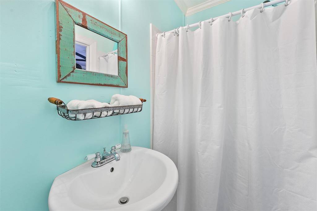 Small bathroom in the downstairs room that could make a great 3rd bedroom.