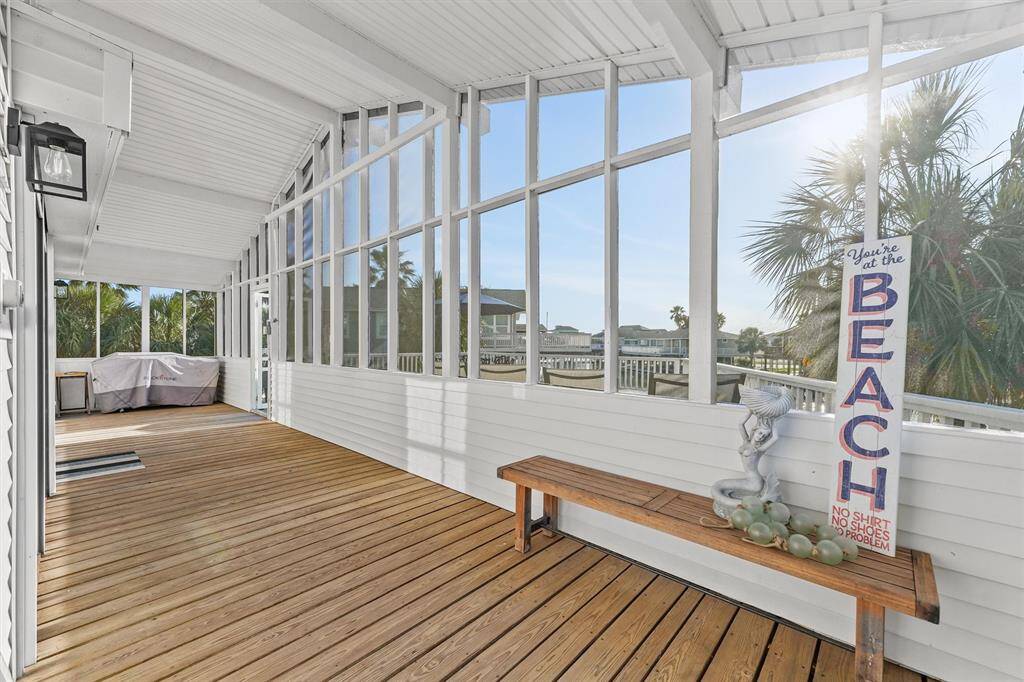 You will love thisinviting screened-in porch featuring wood flooring and expansive windows. It offers views of the Canal.   Perfect for enjoying outdoor relaxation.