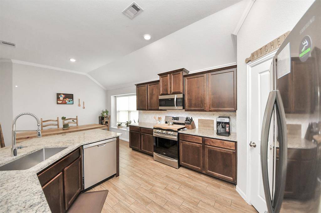 The kitchen includes stainless steel appliances!