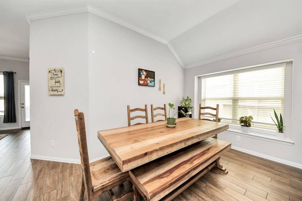 The dining space located next to the kitchen has lots of natural light and a window bench!