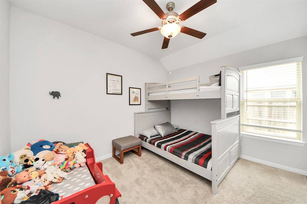 Bedroom #1 has high ceilings and a ceiling fan.