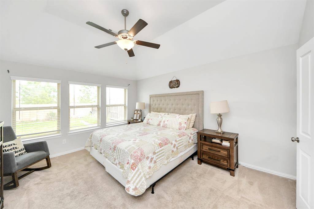 The primary bedroom offers plenty of space for a king size bed, and large furniture!