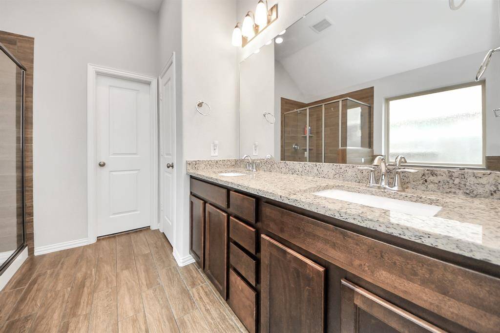 Dual sinks, large countertop, expanded mirror and storage space makes mornings easier!