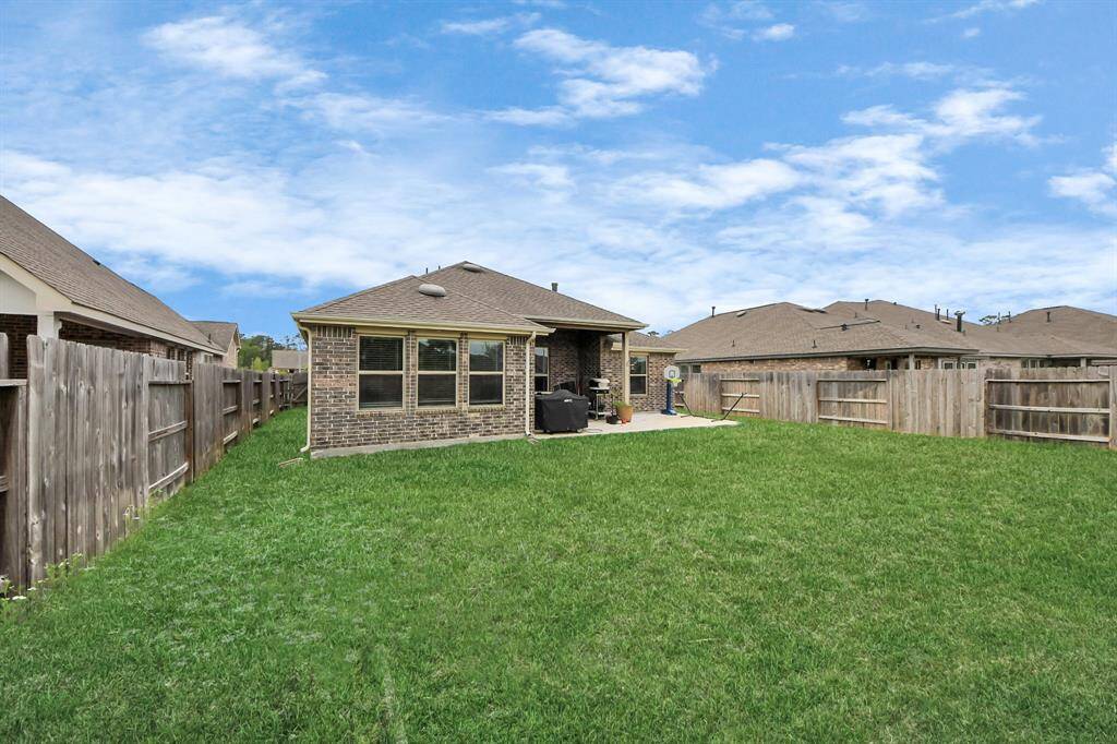 Enjoy outdoor dinners on this expanded back patio, with an exterior gas line!