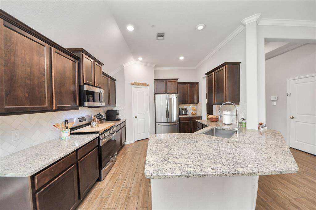 The kitchen includes plenty of storage and countertop space.