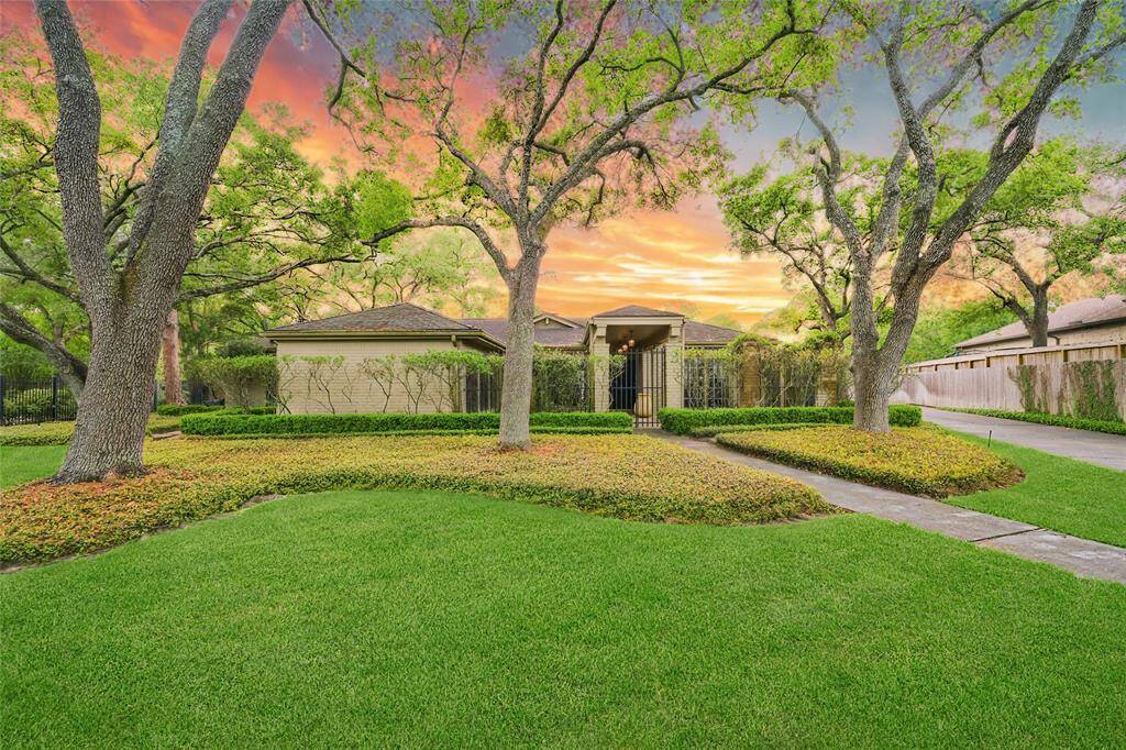 Nestled on a quiet cul-de-sac, this beautifully maintained ranch-style home offers timeless curb appeal, mature trees, and a serene half-acre+ setting. A rare opportunity to enjoy as-is or transform into your dream estate in Piney Point Village.