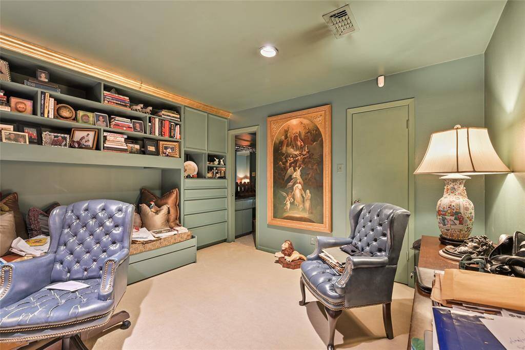 This multi-functional space doubles as a study, library, or creative nook—featuring built-in shelves, custom cabinetry, and cozy seating.