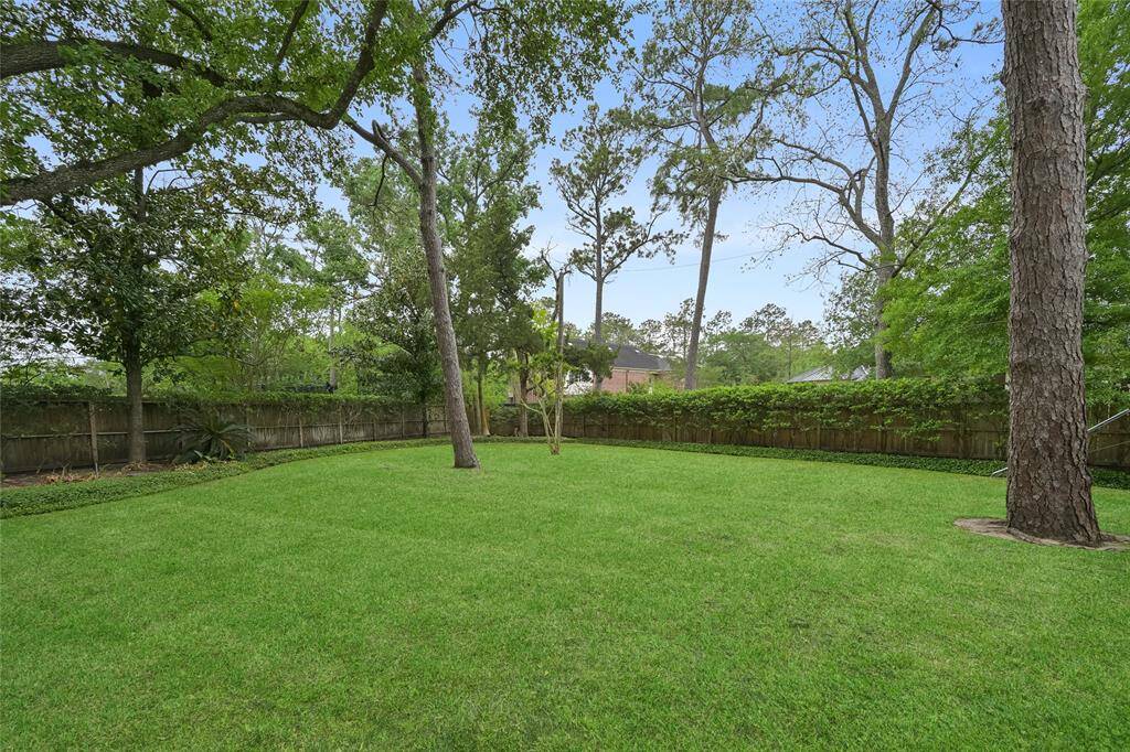 Endless possibilities await—this oversized lot offers 26,360 sq.ft. of space to play, relax, or expand, all within the privacy of a fully fenced yard.