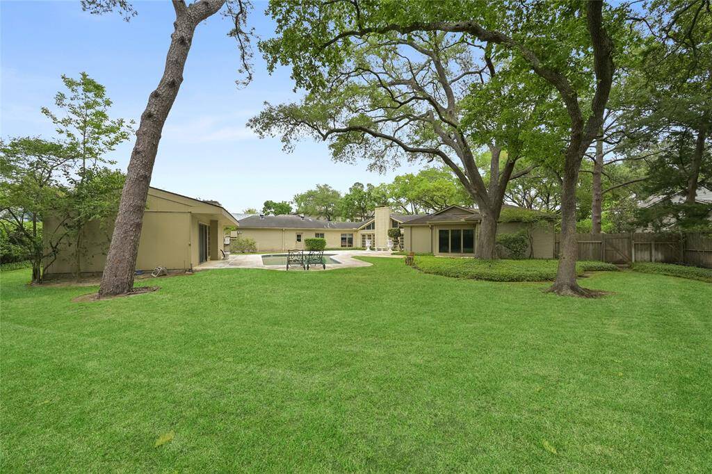 Create your perfect outdoor retreat in this serene setting, where mature trees and open green space provide a peaceful, shaded escape.