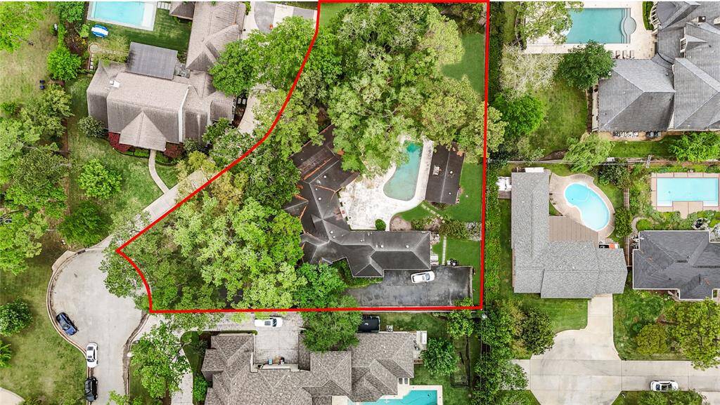 A gem in prestigious Piney Point—over 26,000 sq. ft. of land with a pool, long driveway, and mature trees setting the stage for your dream estate.