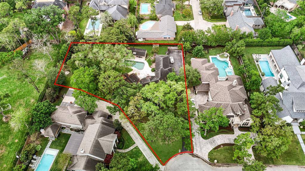 A bird’s-eye view reveals the expansive 26,360 sq.ft. lot with towering trees, manicured landscaping, and an unbeatable location in Piney Point Village—full of charm, privacy, and unlimited potential.