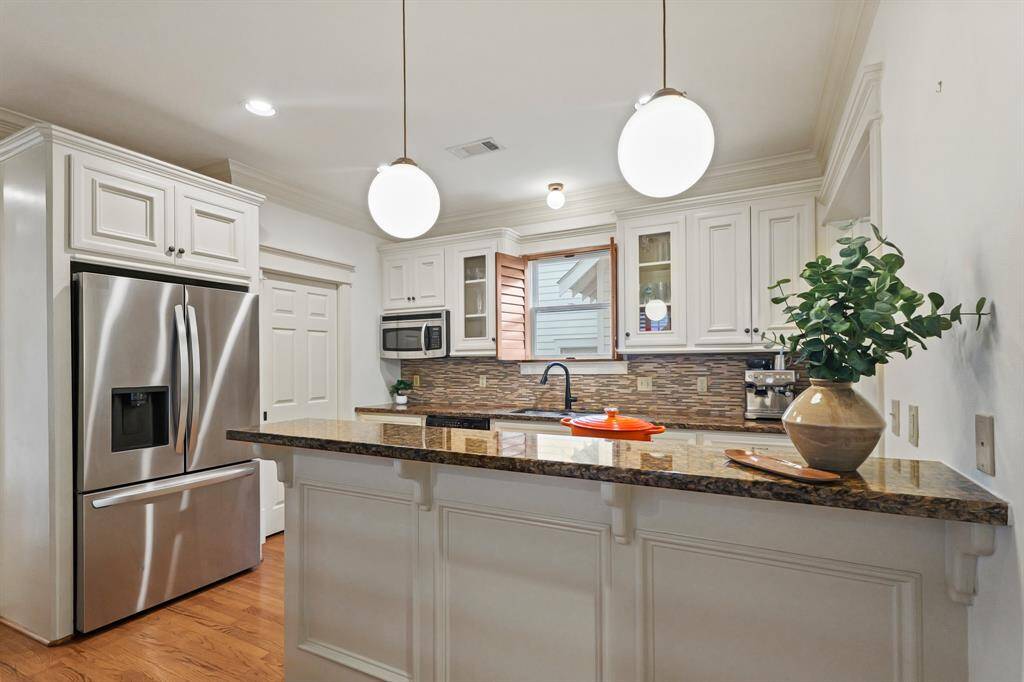 The decorative pendant lighting, adds a stylish and contemporary touch to the space.