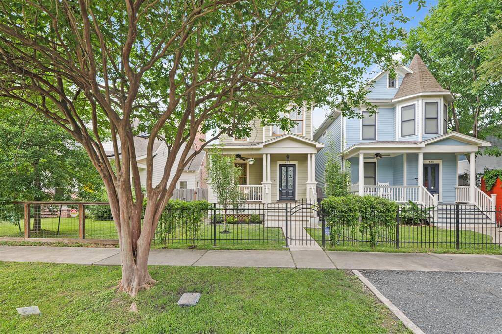 Front gate providing added privacy and curb appeal, enhancing the entrance to the property