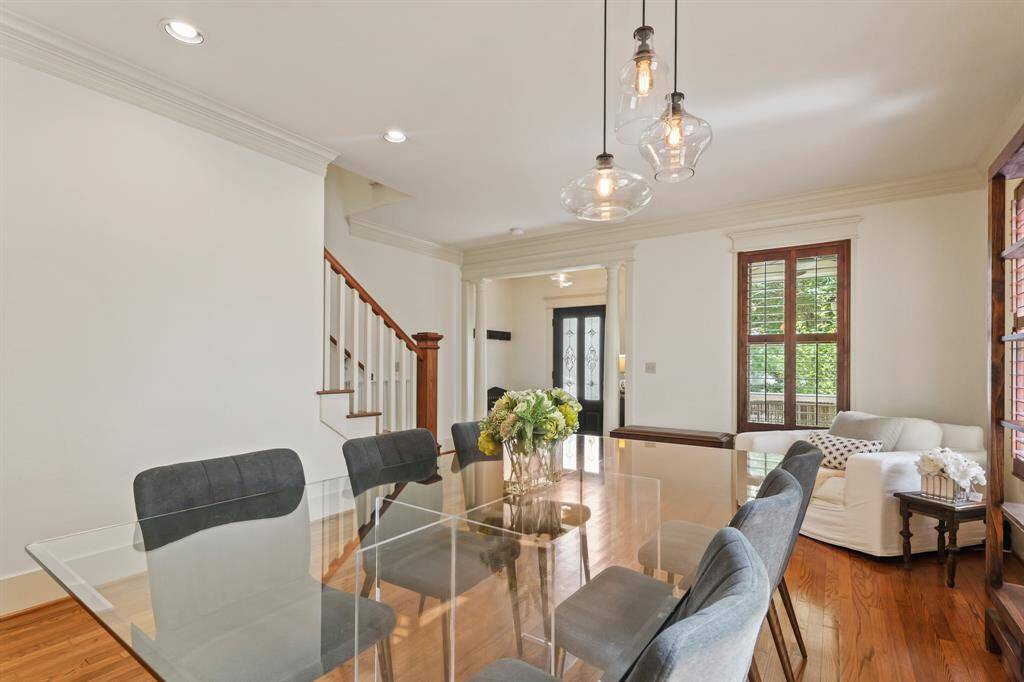 Dining room with a clear view toward the front entry and staircase—welcoming layout with great sightlines.