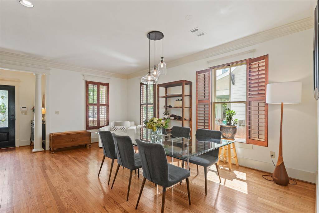 Plantation shutters allow for customizable natural light, enhancing the room's ambiance