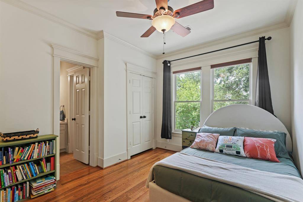 Well-sized bedroom featuring ample closet space, neutral tones, and a comfortable layout perfect for relaxation and rest
