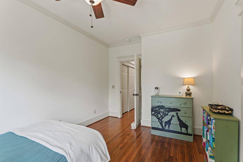 Note the high ceilings, crown molding, and rich wood floors, creating a timeless and open feel