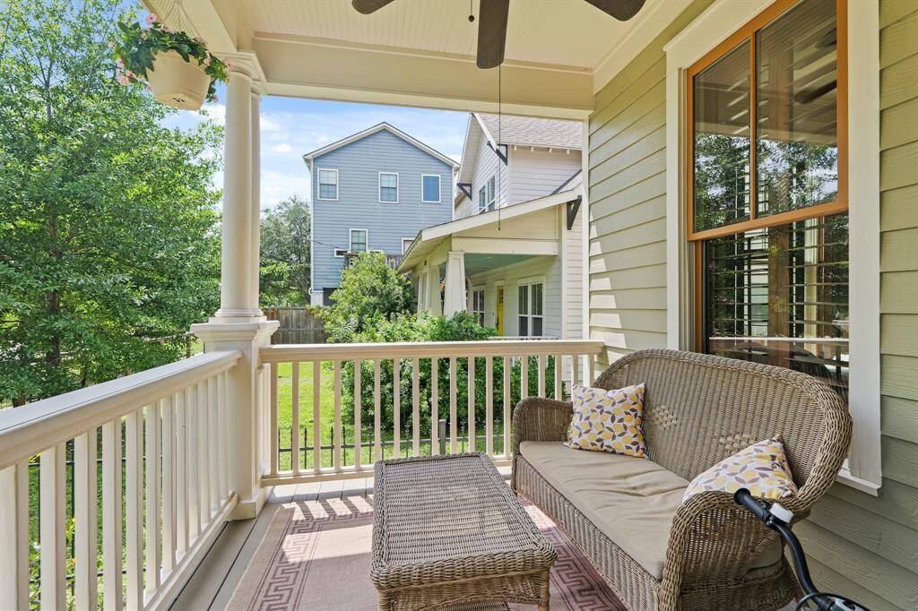 Inviting front porch with a covered entry, room for seating, and a charming architectural touch that adds to the home’s curb appeal.