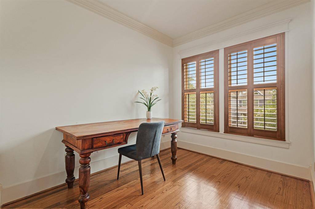 Ideal for a quiet sitting area or workspace, offering a peaceful spot with ample natural light.